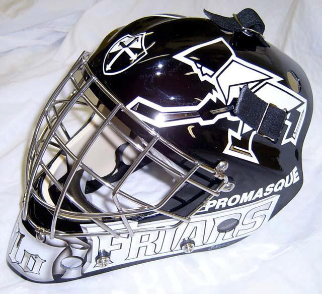 A black and white ice hockey goalie mask with graphics and a metal cage.