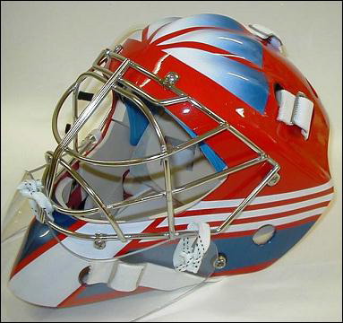 Red and blue hockey goalie mask with a protective cage.
