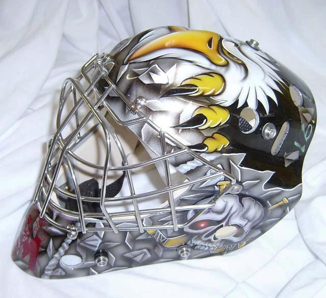 Custom painted ice hockey goalie mask with eagle design.